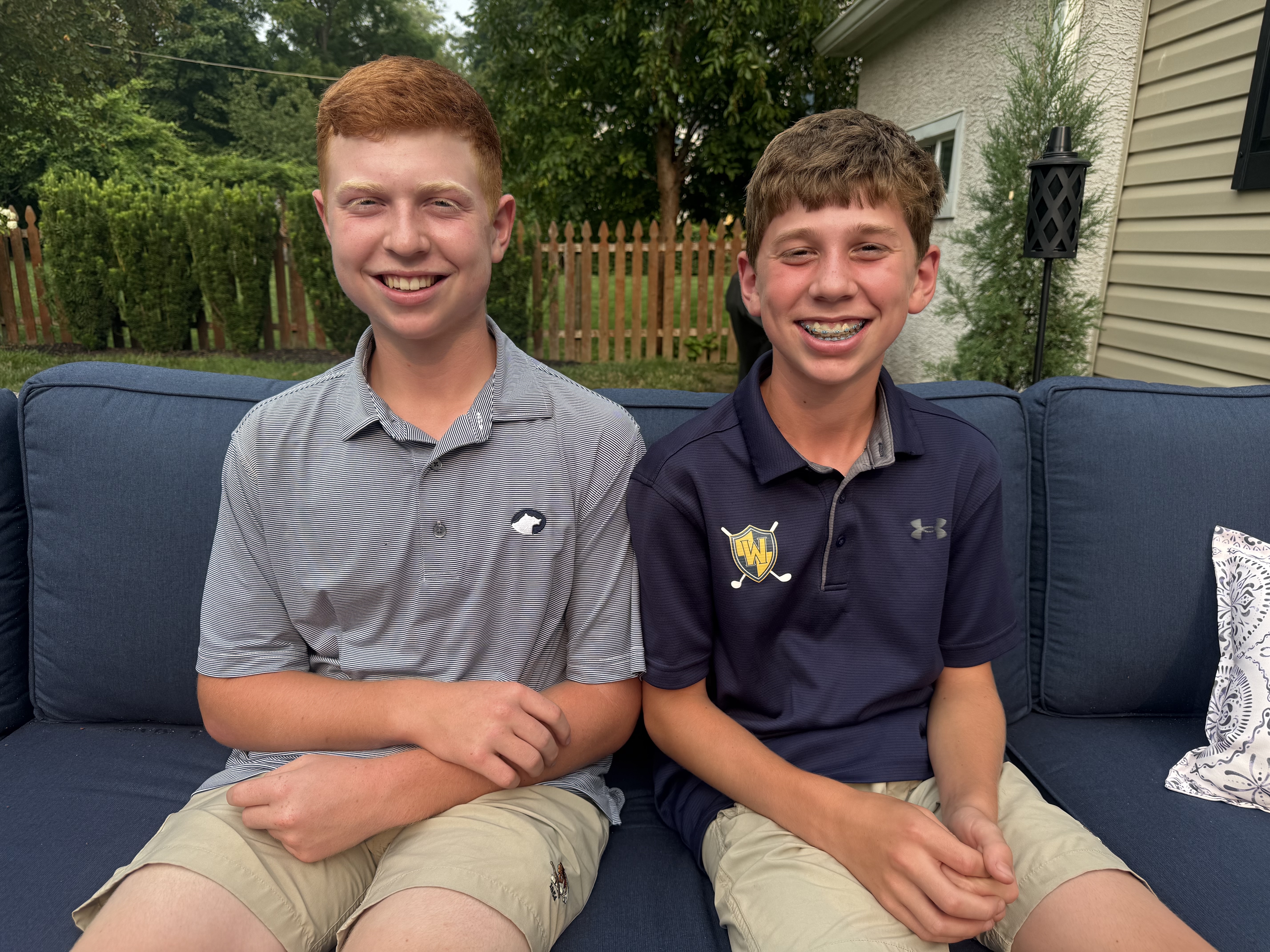 Tim and Conor smiling together outdoors